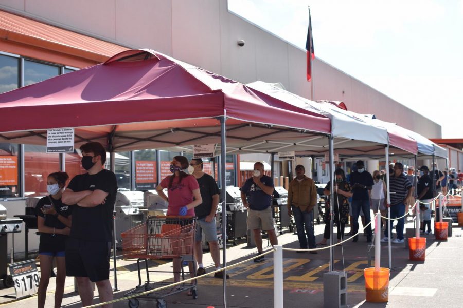 Customers wait outside a Home Depot in Houston TX, on May 2, 2020.