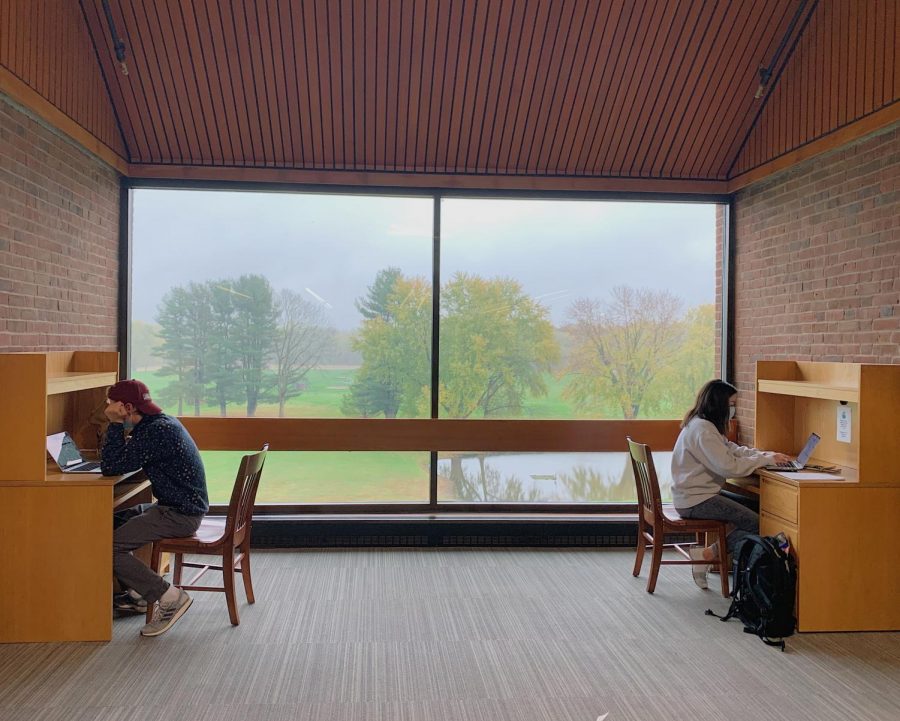 Students in Katherine Brush Library wear masks and social distance to abide by the school's new protocols.