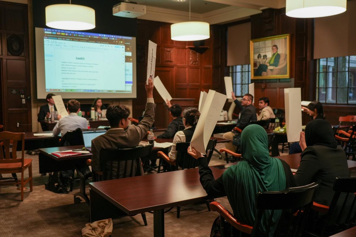 A LooMUN committee on the use of AI in healthcare in action in Founders Lounge.